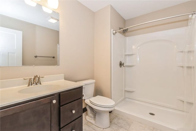 bathroom with walk in shower, vanity, tile patterned floors, and toilet