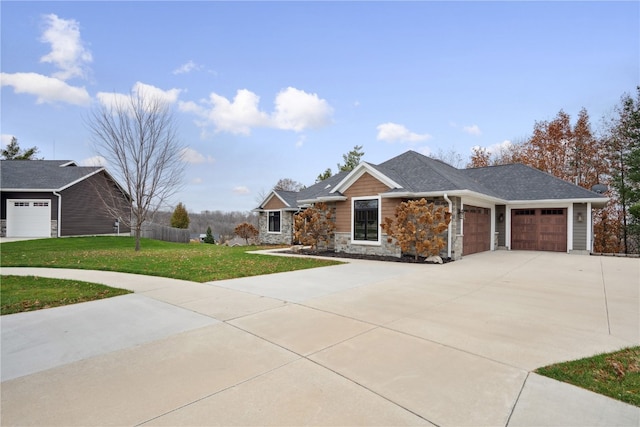 ranch-style home featuring a garage and a front lawn