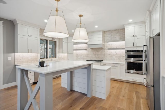 3037 Dell Ridge Ct, Hiawatha, IA 52233 - kitchen featuring appliances with stainless steel finishes, tasteful backsplash, light countertops, white cabinetry, and recessed lighting