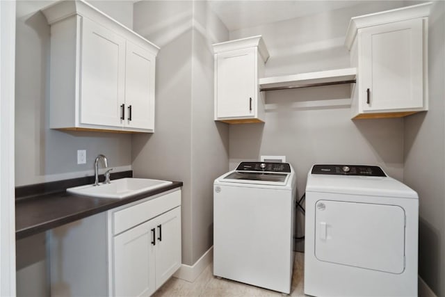 3037 Dell Ridge Ct, Hiawatha, IA 52233 - washroom featuring washing machine and dryer, cabinet space, and baseboards