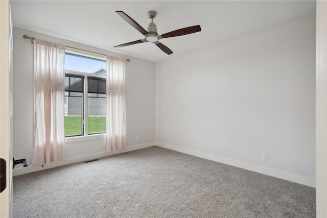3037 Dell Ridge Ct, Hiawatha, IA 52233 - carpeted spare room featuring healthy amount of natural light, ceiling fan, and baseboards