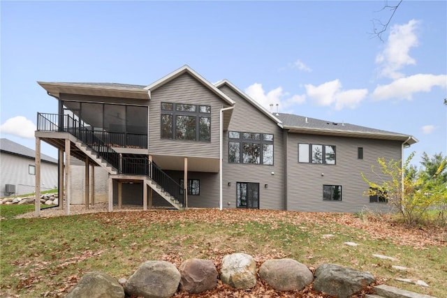 3037 Dell Ridge Ct, Hiawatha, IA 52233 - rear view of property with stairway and a sunroom