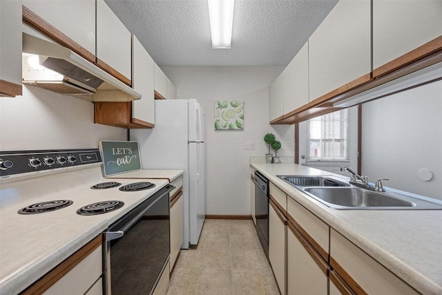 kitchen featuring white cabinets, range with electric stovetop, sink, and a textured ceiling