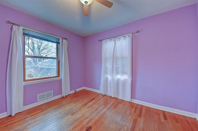 empty room featuring ceiling fan and light hardwood / wood-style floors