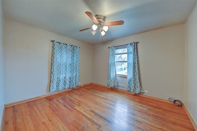 unfurnished room featuring ceiling fan and light wood-type flooring