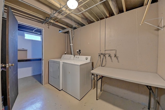 laundry area with independent washer and dryer