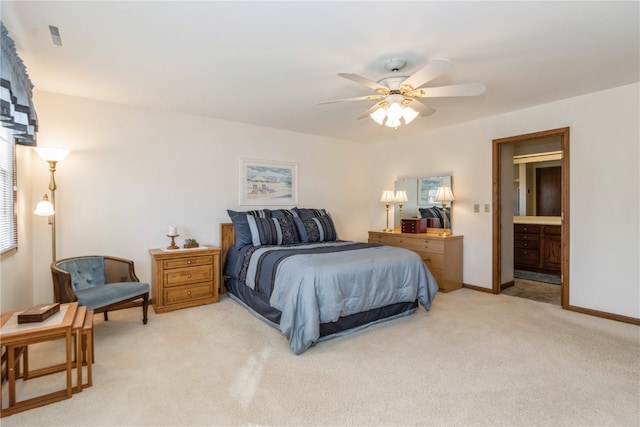 carpeted bedroom featuring connected bathroom and ceiling fan