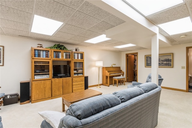 living room with light colored carpet and a drop ceiling