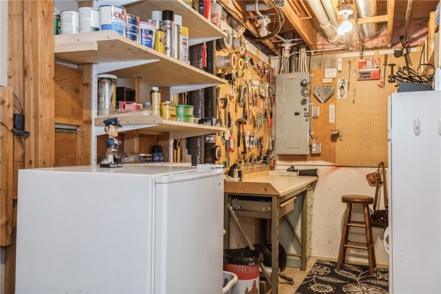 clothes washing area featuring a workshop area and electric panel