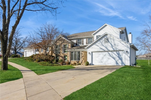 traditional home with a chimney, a front lawn, driveway, and an attached garage