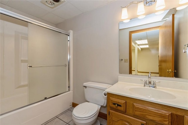 bathroom with toilet, tile patterned floors, shower / bath combination with glass door, and vanity