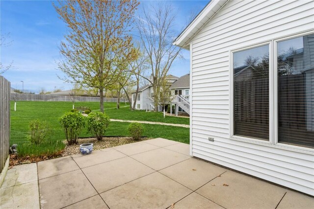 view of patio / terrace featuring fence
