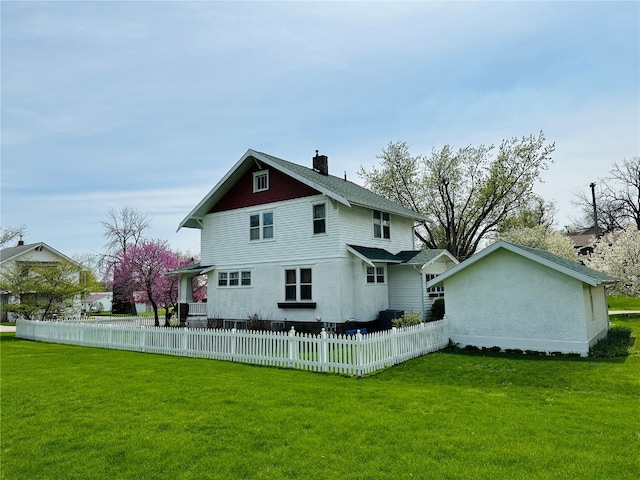 back of property with a yard