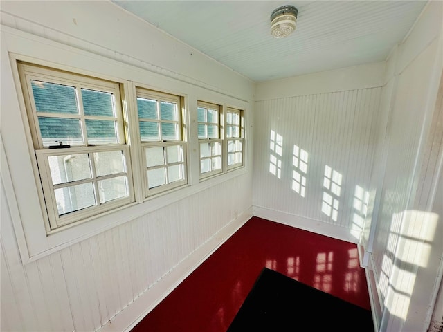 unfurnished sunroom with plenty of natural light