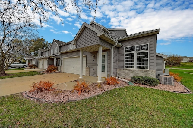 view of front of home with a front lawn and a garage