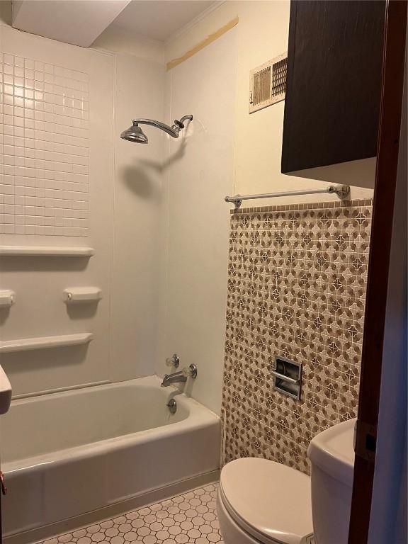 202 N Williams St, Anamosa, IA 52205 - bathroom featuring toilet and  shower combination