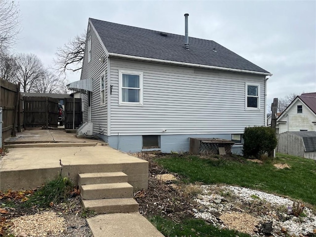 202 N Williams St, Anamosa, IA 52205 - back of house with a shingled roof