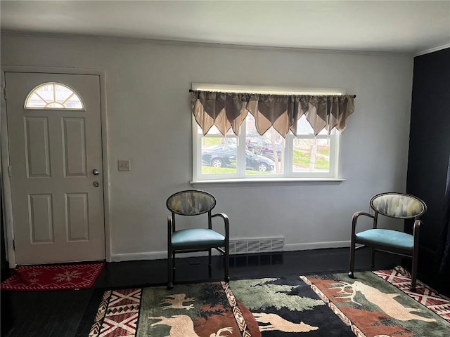 202 N Williams St, Anamosa, IA 52205 - foyer entrance featuring ornamental molding and baseboards
