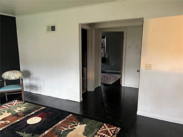 202 N Williams St, Anamosa, IA 52205 - corridor with dark wood-style floors, baseboards, and crown molding