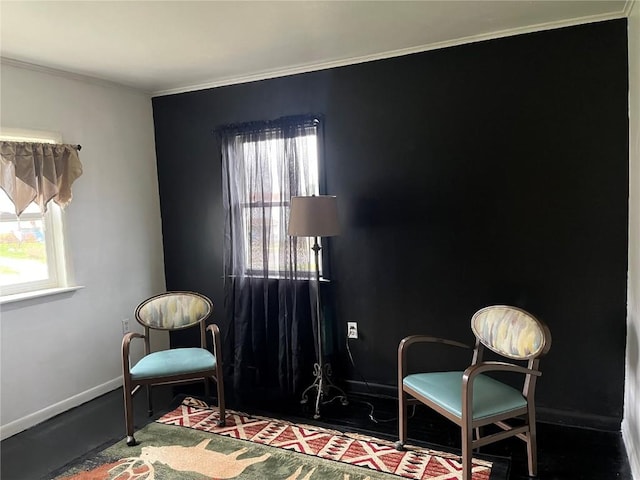 202 N Williams St, Anamosa, IA 52205 - living area with plenty of natural light, crown molding, and baseboards