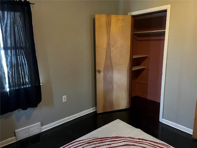 202 N Williams St, Anamosa, IA 52205 - unfurnished bedroom with baseboards
