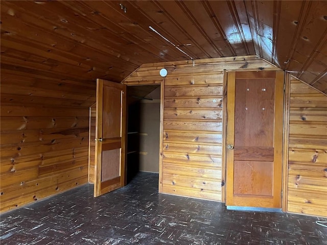202 N Williams St, Anamosa, IA 52205 - bonus room with lofted ceiling, wooden walls, wood ceiling, and dark floors