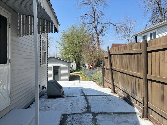 202 N Williams St, Anamosa, IA 52205 - view of patio / terrace featuring an outbuilding