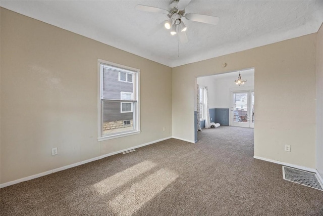 452 8th Ave SW, Cedar Rapids, IA 52404 - empty room with carpet flooring, ceiling fan, and a textured ceiling