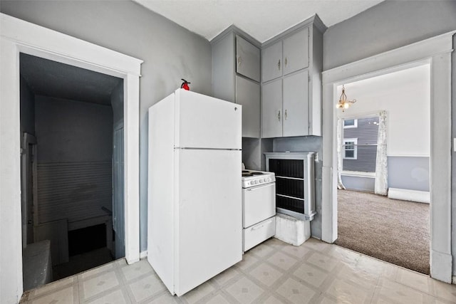 452 8th Ave SW, Cedar Rapids, IA 52404 - kitchen featuring white appliances, gray cabinets, and light floors