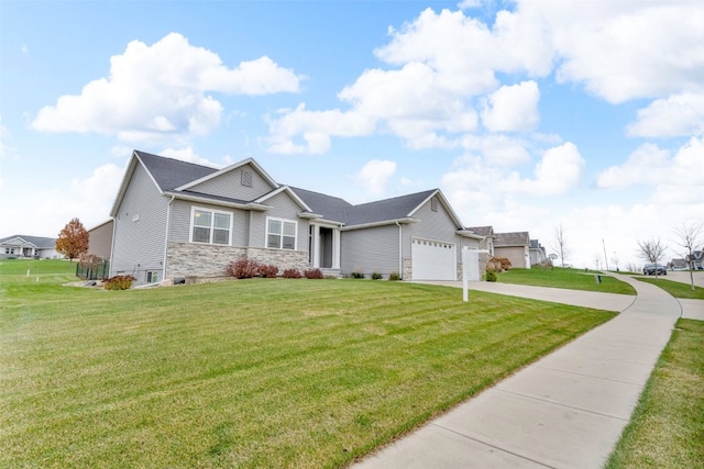 view of front facade featuring a front yard and a garage