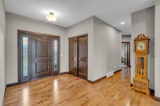 foyer with light hardwood / wood-style floors