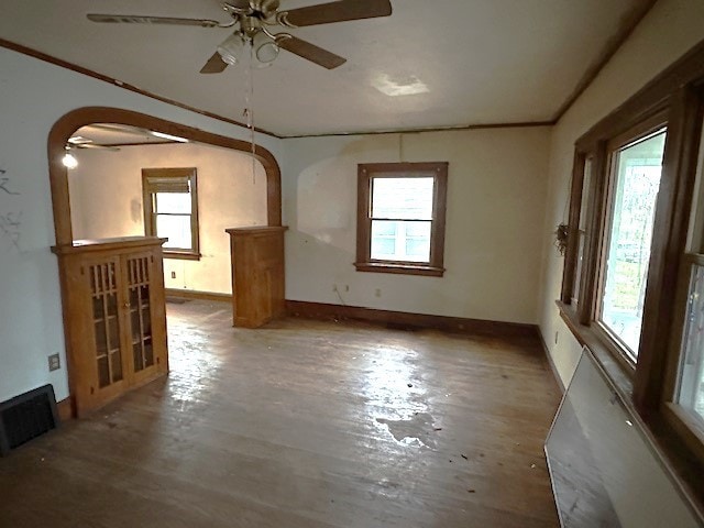 empty room with ceiling fan and wood-type flooring