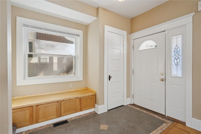 entryway with visible vents and baseboards