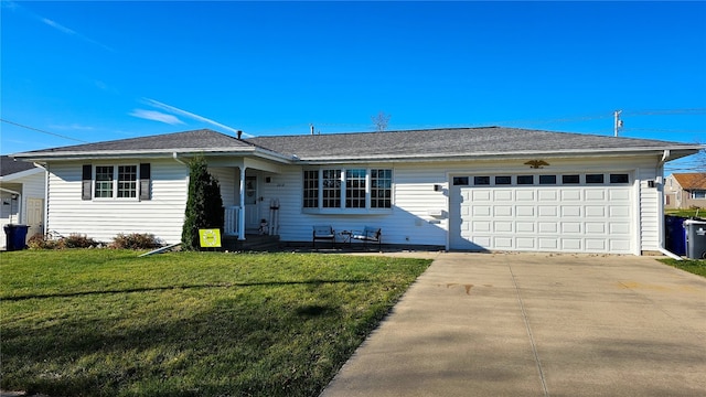 single story home featuring a garage and a front lawn