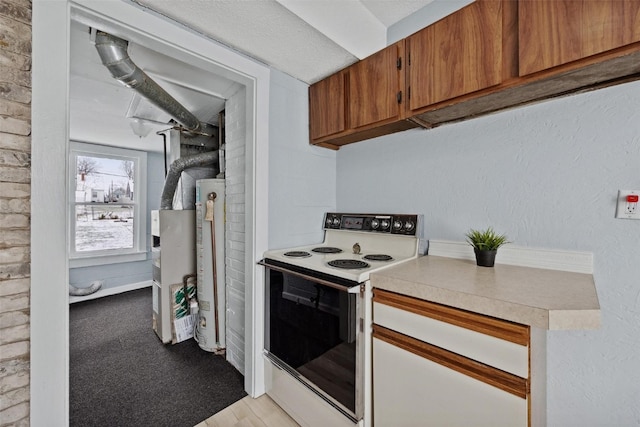 kitchen featuring white range with electric stovetop, light colored carpet, a textured ceiling, and water heater