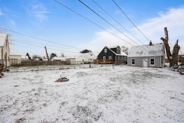 view of yard layered in snow