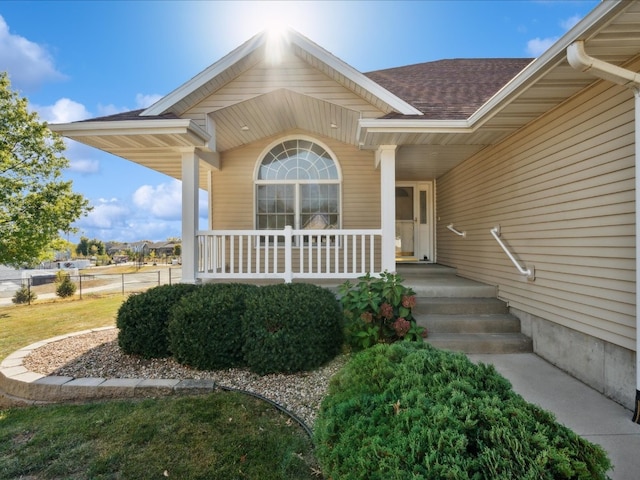 doorway to property with covered porch