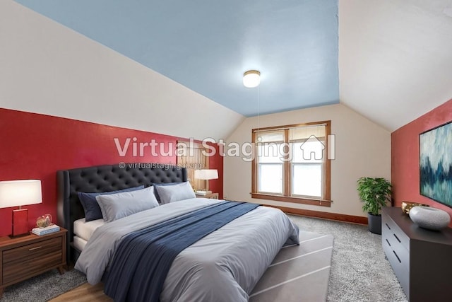 carpeted bedroom featuring vaulted ceiling