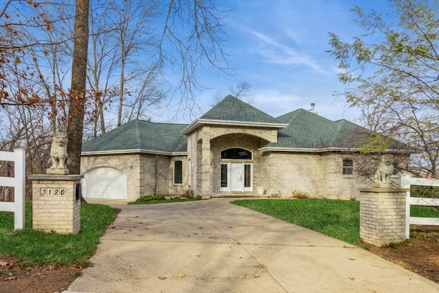 view of front of home with a garage