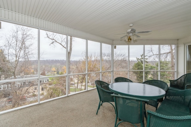 sunroom with ceiling fan and plenty of natural light