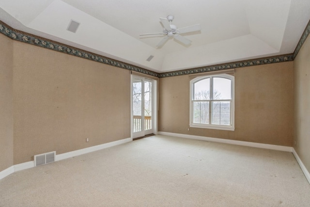 unfurnished room with ceiling fan, light carpet, and vaulted ceiling