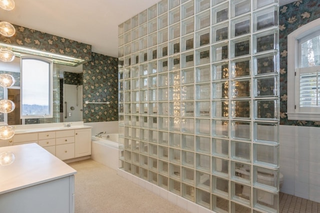 bathroom with separate shower and tub and vanity