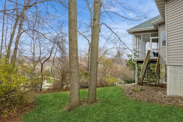 view of yard featuring a sunroom