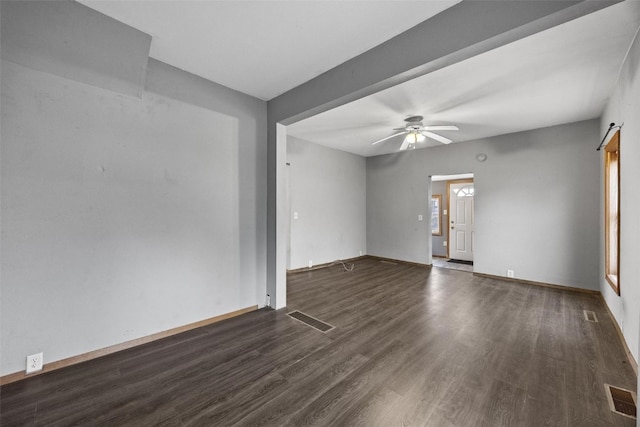 unfurnished room featuring ceiling fan and dark wood-type flooring