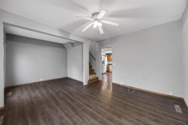 interior space with ceiling fan and dark hardwood / wood-style floors