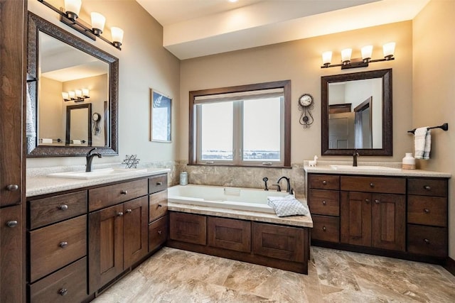 bathroom with vanity and a bathtub