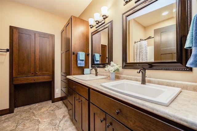 bathroom featuring vanity and curtained shower