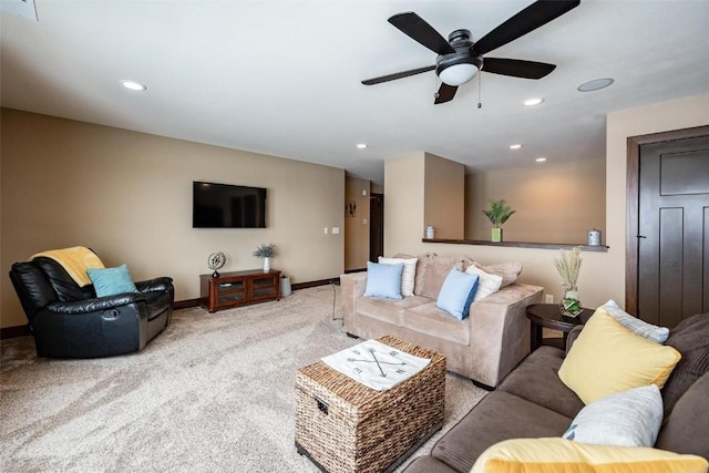 carpeted living room featuring ceiling fan