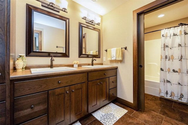 bathroom featuring tile patterned flooring, vanity, and shower / bath combination with curtain