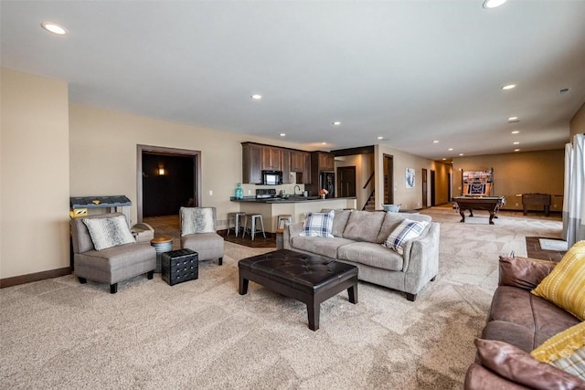 carpeted living room featuring pool table and sink